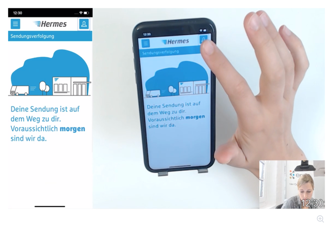 Participant comparing visual variants for the delivery journey on a phone